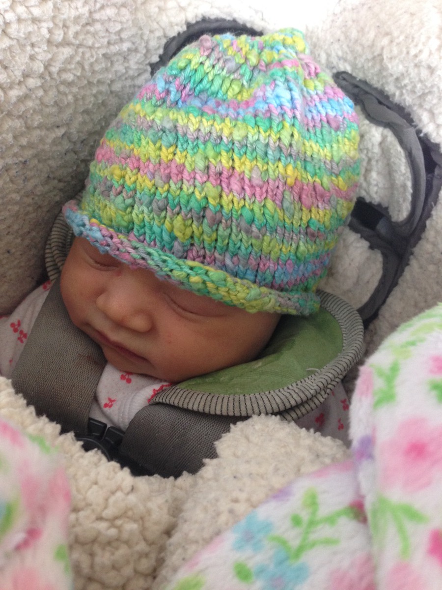 Infant with handknit hat
